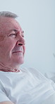 Senior, sad and man in hospital bed for cancer, bad news or grief with expression for mourning. Elderly, male person or patient crying with emotion for past memory, loss or reflection in clinic
