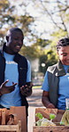Volunteers, happy and people in park for food drive, charity event and outreach for non profit. Outdoor, team and men with women with boxes, groceries and donations for aid, help and ngo support