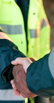 Engineer, meeting or handshake with deal on construction site for teamwork or agreement. Contractor, civil architecture or people shaking hands for b2b support, partnership or building development