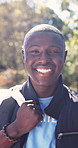 Happy, black man and face of volunteer in nature with trash bag for cleaning community with NGO. Smile, garbage and portrait of charity worker with pride for non profit organization outdoor in park.