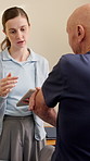 Tablet, physiotherapist and senior man with arm injury, pain or accident with consultation for healing. Checkup, technology and elderly patient with recovery for muscle sprain at physical therapy.