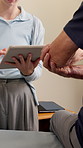 Tablet, physiotherapist and senior man with elbow injury, pain or accident with consultation for healing. Checkup, technology and elderly patient with recovery for muscle sprain at physical therapy.