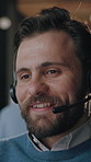 Customer care, smile and man in call center, talking and virtual assistance with feedback. Contact us, agent and person with headset for support service, online communication and happy to help