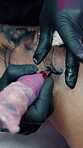 Artist, hands and tattoo for client in shop, aesthetic and creative ink design with tool and skills. Needle, sketch and person with equipment, identity and self expression with body art in store