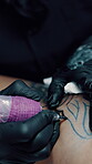 Tattoo artist, hands and outline on leg in shop, aesthetic and ink design with equipment and skills. Needle, sketch or person with tool for self expression, creative and client with body art in store