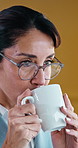 Thinking, coffee and glasses with business woman in office for reflection, morning drink and vision. Productivity, perspective and memory with mature person in agency for beverage, peace and idea