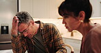 Stress, couple and argument in kitchen for marriage problem, divorce and toxic relationship. Mature man, woman and quarrel at home, fight and frustrated partner with conflict for cheating affair