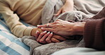 Woman, bedroom and holding hands with sick child for comfort with infection, flu or help in family home. Kid, ill and mother with support for wellness, recovery or healing with empathy or compassion