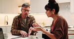 Laptop, couple and argument for bills in kitchen, wrong expenses or stress with mortgage paperwork. Computer, mature people and debt quarrel, financial conflict and point for disagreement at home