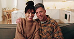 Face, hug and happy couple with love in home for holiday, comfort or bonding together on sofa. Portrait, man and woman relax with smile, care or embrace for weekend, break or rest on couch in house