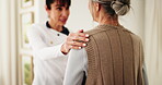 Healthcare, old woman and caregiver support in home with health checkup, follow up care or service. Hand on shoulder, senior patient or carer in homecare for medical advice, encourage healing or help