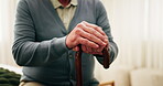 Hands, old man and relax in home with walking stick, mobility support and recovery from injury. Rest, house and senior person with disability, muscle stiffness and stability from parkinson disease