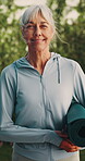 Face, woman and smile with yoga mat outdoor, exercise and wellness with equipment for hobby. Female person, happy and senior yogi in portrait with fitness for balance, health benefits and retirement