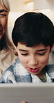 Grandmother, child and smile in home with tablet, browsing and download ebook for education. Senior woman, rest or kid in lounge with digital, watching video and educational games for online learning