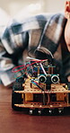 Child, dad and toy car with wires for engineering or remote control vehicle in home together. Boy, kid or learning with father to build robotic transportation for junior mechanic or development