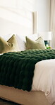 Hotel, bedroom and interior of empty room, hospitality service and luxury accommodation for travel. Bedding, pillow and motel or lodge with cozy blanket, comfort and resort design with furniture