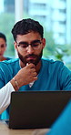 Man, students and thinking in medical school with laptop, learning knowledge and research in classroom. Person, problem solving and computer in college with nursing course, education and healthcare.