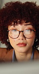 Computer, data analysis and woman with glasses in office, reflection and financial update on website. Serious, treasury manager and person with eyewear, graphs and risk assessment with technology