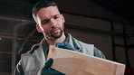 Man, check and carpenter in workshop with plank, inspection and quality control for manufacturing. Male person, carpentry and wood in factory for timber textures, woodworking and furniture production