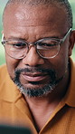 Reading, home and black man with glasses on laptop for copywriting, manuscript or online article. Male person, journalist or author typing with spectacles for digital story, ebook or publish in house
