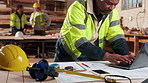 Architect, man and planning with blueprint on laptop in workshop for building project or structure. Male person, computer or checking floor layout for construction design, safety or security on site