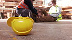 People, construction and helmet with accident for emergency, help or danger in workplace. Contractor, pain or injury with first aid assistance for fall, building mistake or disaster on working site.