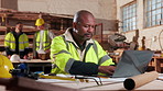 Carpenter, man and typing in workshop with laptop, design document review and plan for manufacturing. Mature person, carpentry designer and research with computer, woodwork production and project.
