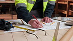Blueprint, architecture and writing with hands in workshop for site plan scale, review or property development. Layout, renovation and engineer design with person for expansion, project or building