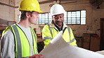 Blueprint, architecture and talk with people in warehouse for site plan scale, review or property development. Meeting, renovation project and engineer design with men for expansion and building