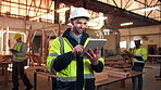 Carpentry, manufacturing and tablet with happy man in factory for agenda, project or schedule update. App, industry and smile with employee in woodwork warehouse for furniture production business
