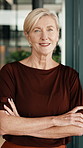 Mature, woman or face with confidence in office for designer career, pride or ambition. Portrait, female person or professional design with smile or arms crossed in workplace for creative startup