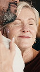 Love, woman or interracial couple in home with support, partner care or bonding together in marriage. Smile, loyalty or mature people with embrace, romantic moment or commitment in happy relationship