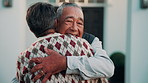 Senior, couple and hug with greeting for welcome, reunion or love together outside retirement home. Elderly, happy man and woman with smile or embrace for comfort, support or relief on doorway