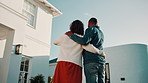Back, couple and pointing at new home for viewing, property purchase and support for relocation. People, embrace and front yard for ownership, house selection and moving in for real estate investment
