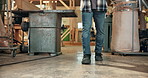 Carpentry, walking and legs of man in workshop for inspection, planning and timber production. Woodworking, carpenter and person in warehouse for manufacturing, lumber business and furniture repair