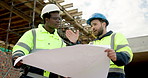 People, conversation and blueprint on construction site for collaboration, inspection or remodeling. Low angle, quality control and architect team for project management, property or renovation