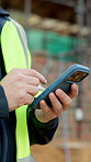 Cellphone, scroll and hands of construction worker on site with email for approval on infrastructure. Phone, man and civil engineer on mobile app for feedback on building, maintenance or repairs.