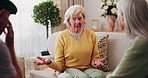Talking, support and relax with old people on sofa in home for chat, connection or bonding. Social gathering, reunion and retirement with senior friends in living room of apartment for solidarity