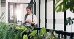 Creative, chatting and woman with phone in office for communication or social media app. Female person, designer or texting with smartphone for network connection or online research in workplace