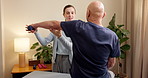 Physical therapy, woman and elderly patient with dumbbell for mobility help, strength and happy with progress. Senior man, physiotherapist and weights for muscle growth, wellness support and health