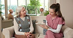 Clipboard, caregiver and senior woman in nursing home for wellness report, feedback and check up. Retirement, writing and nurse with elderly person for assisted living, help and talking for support
