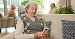 Relax, old woman and typing with phone in retirement for online puzzle, word search and care home. People, senior person and mobile app in assisted living for playing game, web bingo or gambling site