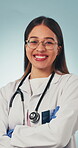 Doctor, face and smile with arms crossed in health for medical service, career integrity or trust. Worker, woman and happy on studio background for healthcare support, cardiology expertise and pride