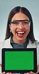 Woman, tablet and green screen in studio with face, smile and excited for medical app. Doctor, digital tech and mockup space for research with feedback, promotion or advertising on white background