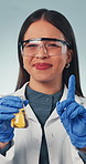 Science, face and woman with beaker for smell with instruction, lab safety or tutorial. Chemistry, test and portrait of person with precaution for liquid, chemicals and thumbs up on studio background
