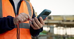 Construction, text or hands on site with phone, task instruction or inspection report in online chat. Typing, man or engineer with tech, project brief or operations schedule on digital platform.