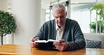 Home, faith and senior man with bible for religious study, spiritual growth or word of God. Retirement, pensioner or reading scripture in Holy book for christian wisdom, praise or learning the gospel