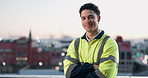 Face, engineer and happy man with confidence on city rooftop, pride or civil engineering professional. Construction, smile or architect outdoor with arms crossed, infrastructure development and bokeh
