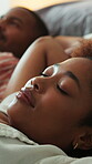 Couple, sleep and tired on bed, home and relax together on break and lazy with partner in apartment. Black people, exhausted and comfortable on weekend, nap and resting with spouse or cozy in house