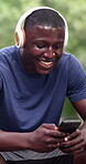 Black man, laugh and phone outdoor with fitness, comment or sports chat with sweat and music. Person, social media post or funny exercise forum after training in park, break or headphones with typing